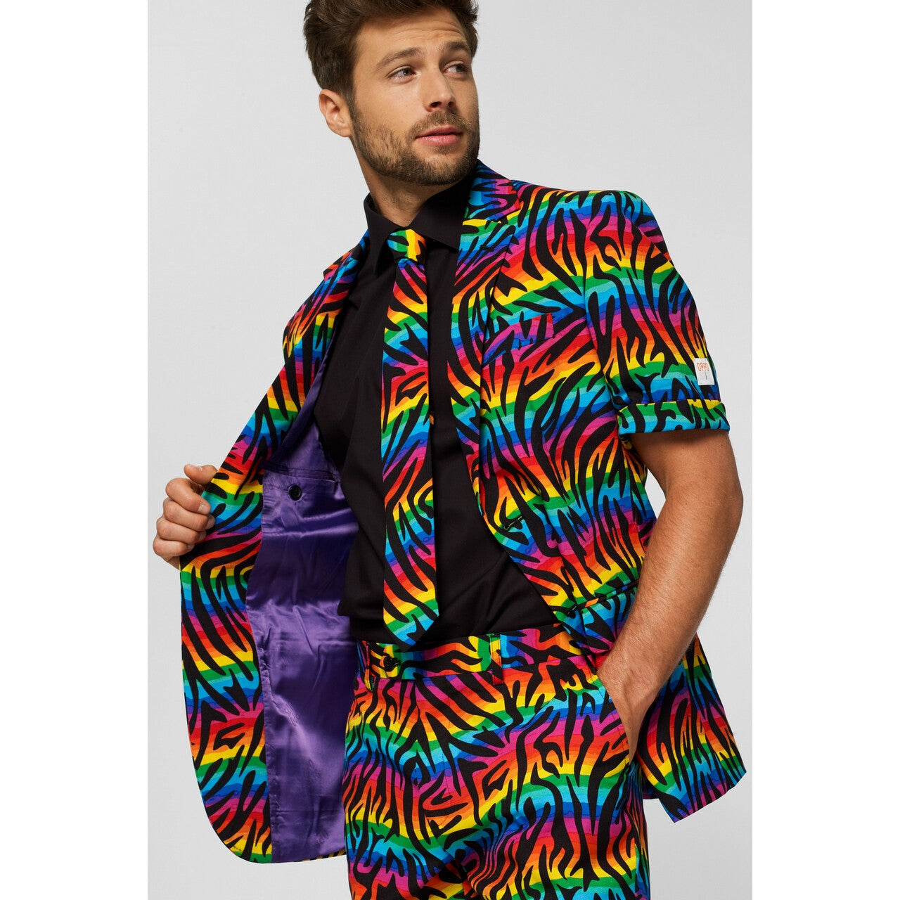 Op deze afbeelding zie je een Kostuums, van het merk Opposuits. Wild Rainbow Zomer Man Kostuum